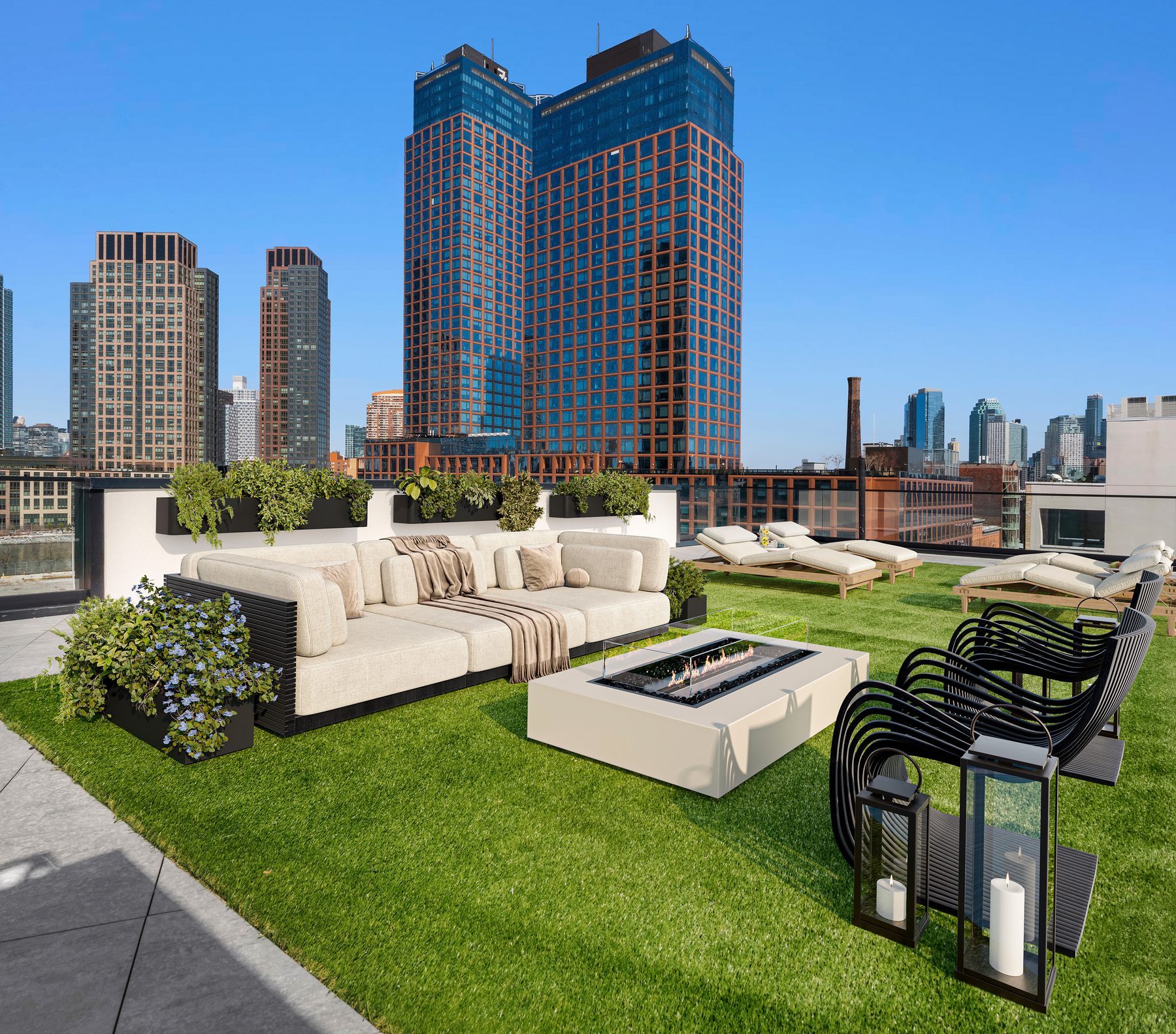 Landscaped rooftop terrace with lounge seating and skyline views